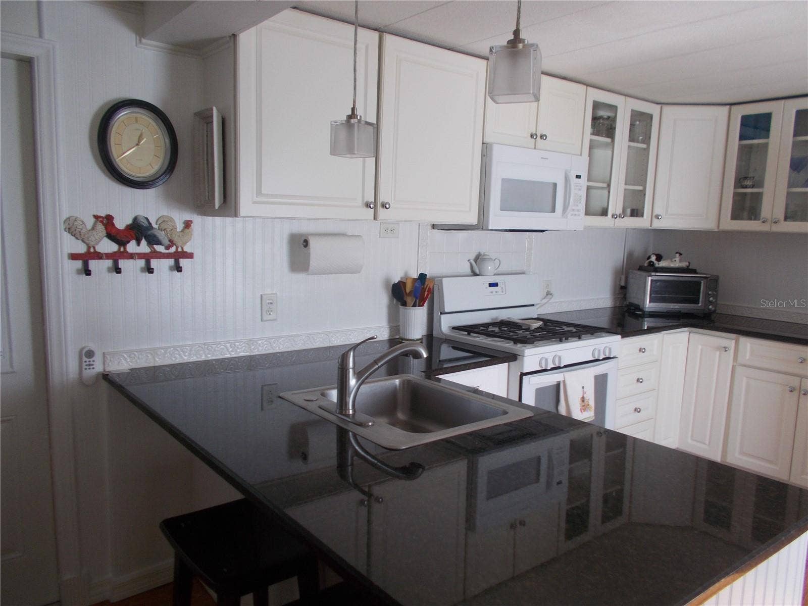 Kitchen showing granite countertop