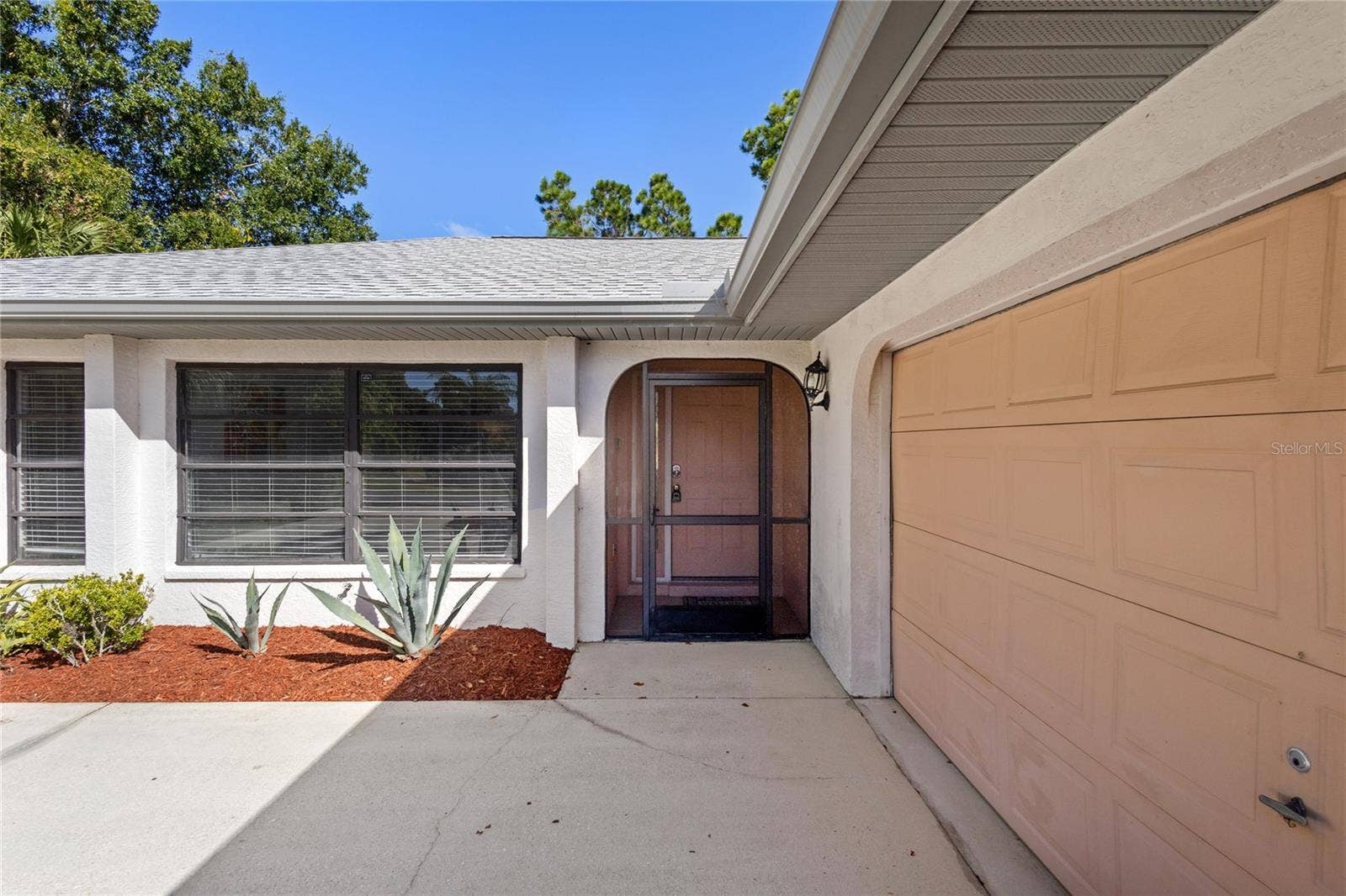 18346 KOALA AVENUE, Port Charlotte, FL 33948 Side load garage.
