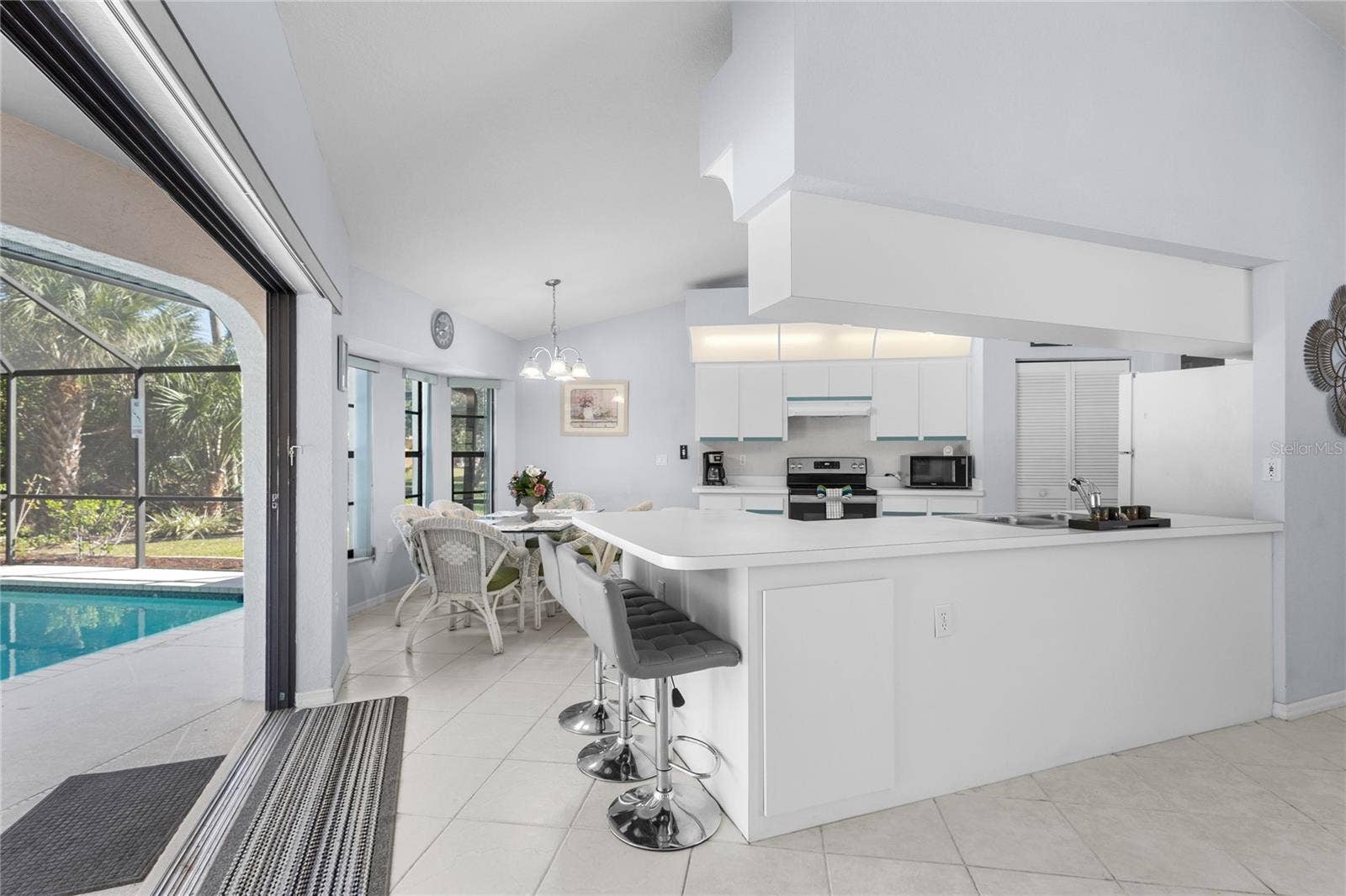 18346 KOALA AVENUE, Port Charlotte, FL 33948 3 pocket sliding glass doors open from the Living Room and Kitchen.