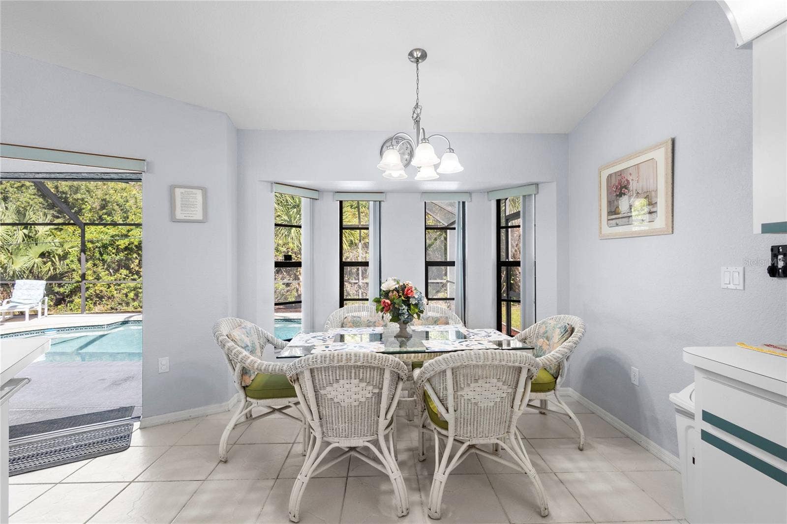 18346 KOALA AVENUE, Port Charlotte, FL 33948 Dinette area overlooking Lanai and pool.