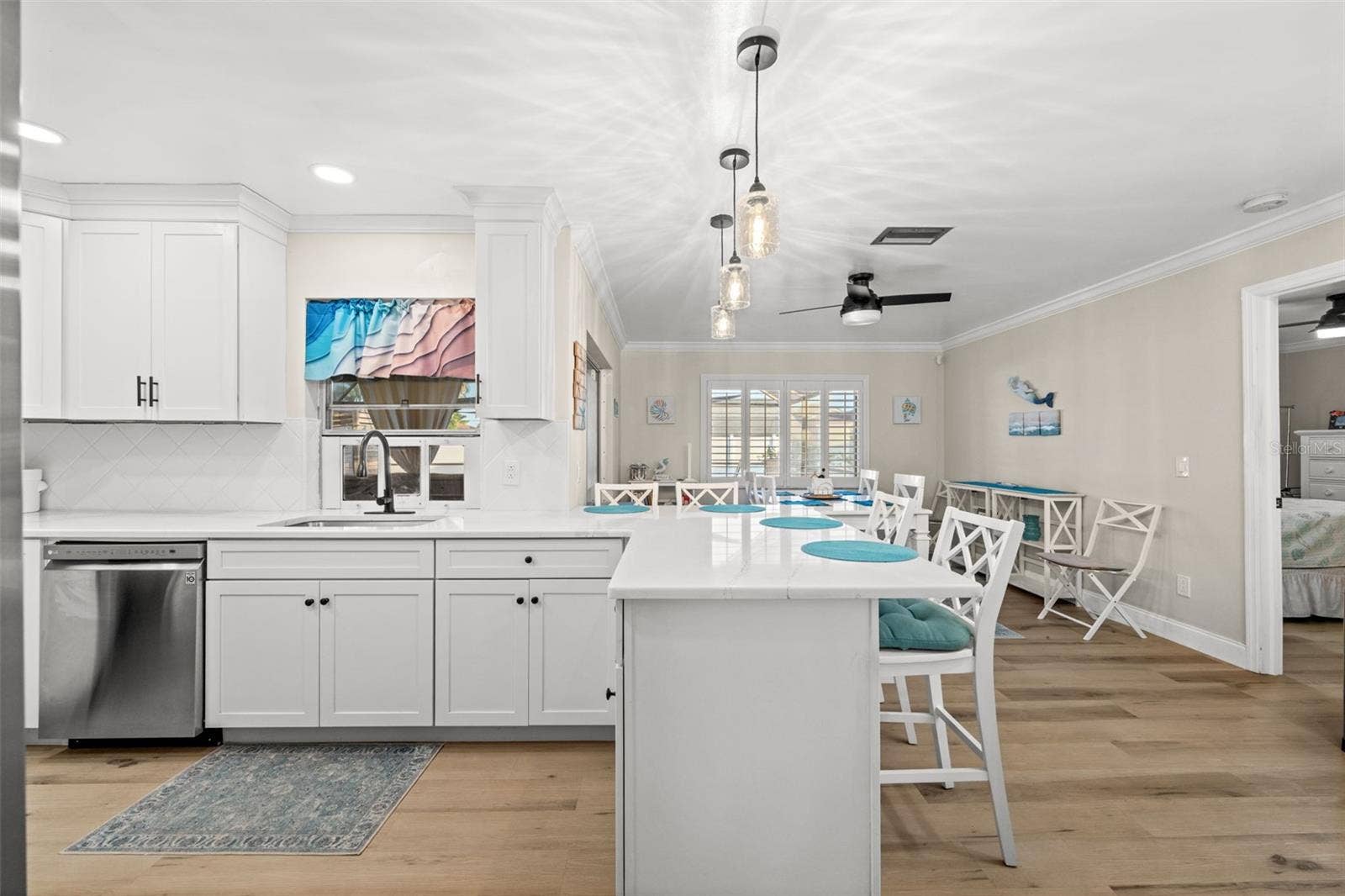 Offering quartz countertops, abundant soft-close cabinetry, and stainless appliances - entertaining will be easy and enjoyable.