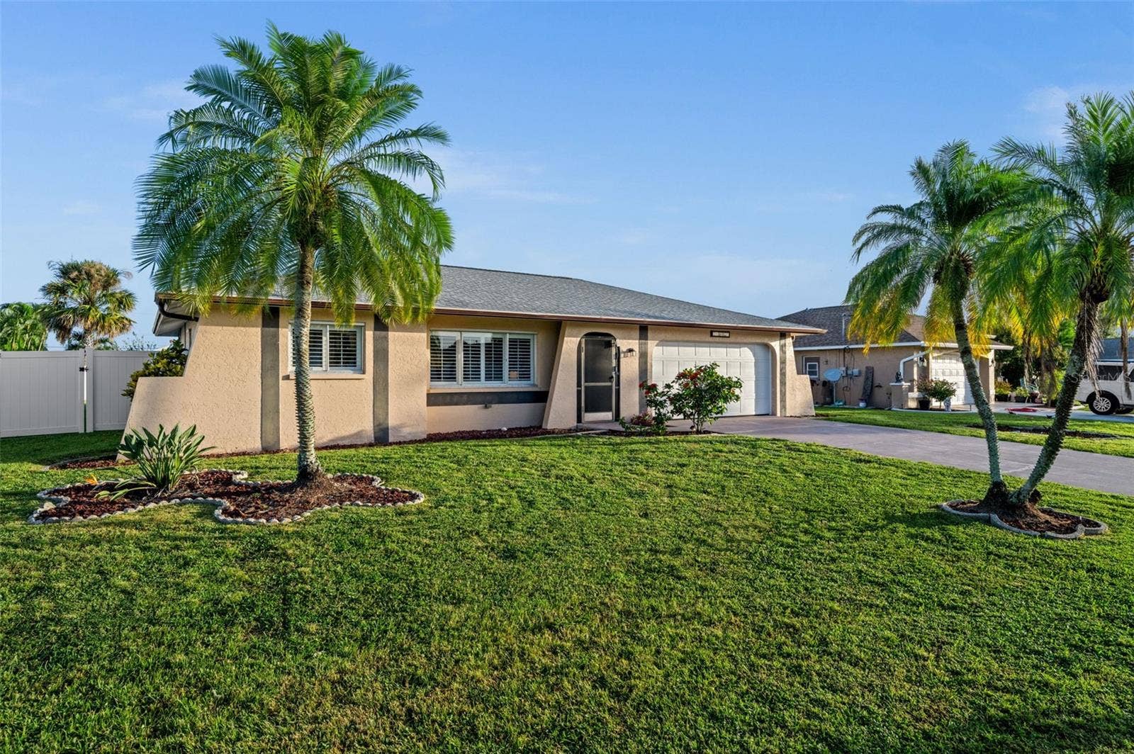 A well-loved home, mature landscaping, an attached 2-car garage...all on a quiet Cape Coral Street.