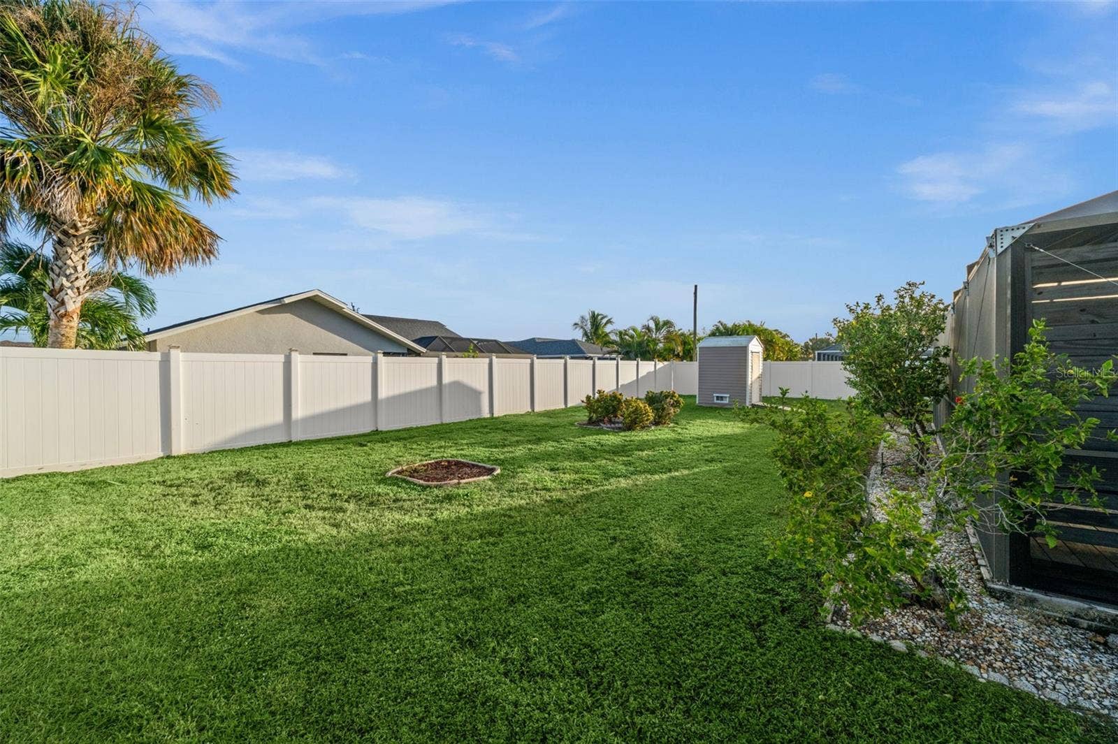 Low maintenance stone and curbing surround this lovely home. There is so much room to add on to this SW Florida outdoor oasis.