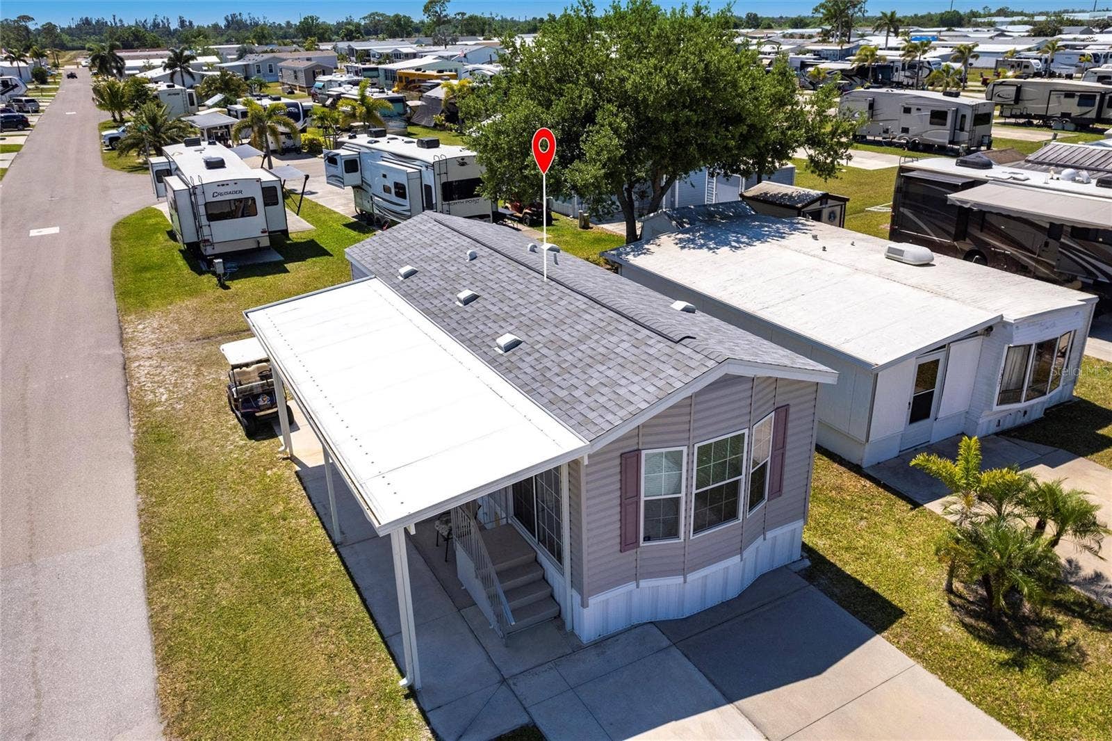 1329 TROUT, Punta Gorda, FL 33950 Aerial view of home and new shingle roof