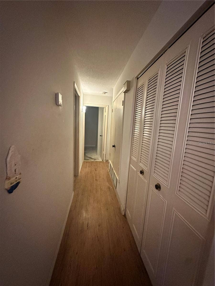 1554 INVERNESS STREET, Port Charlotte, FL 33952 hall to bedrooms