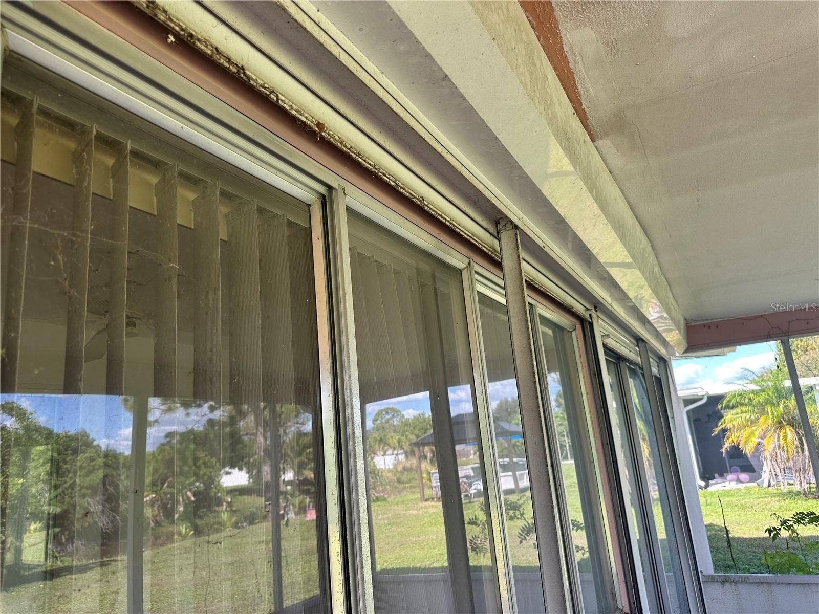 1554 INVERNESS STREET, Port Charlotte, FL 33952 Hurricane shutters on Florida room
