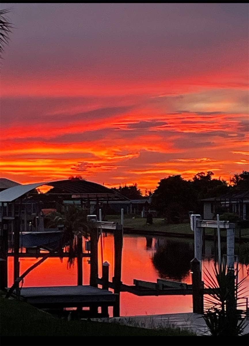 4145 GARDNER DRIVE, Port Charlotte, FL 33952 Enjoy beautiful water views and gorgeous sunsets from this desirable corner lot!