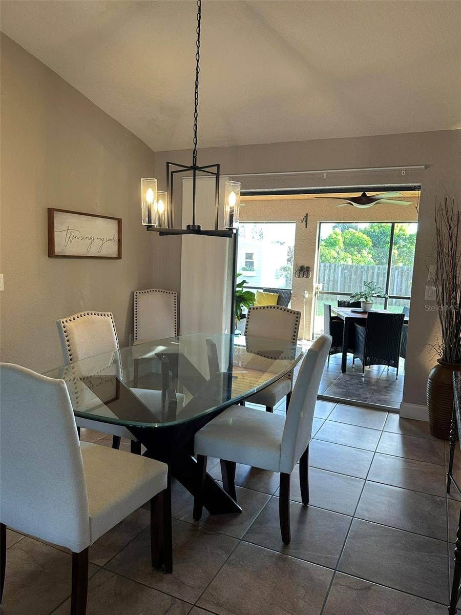 Dining room opens to lanai with pocket sliders