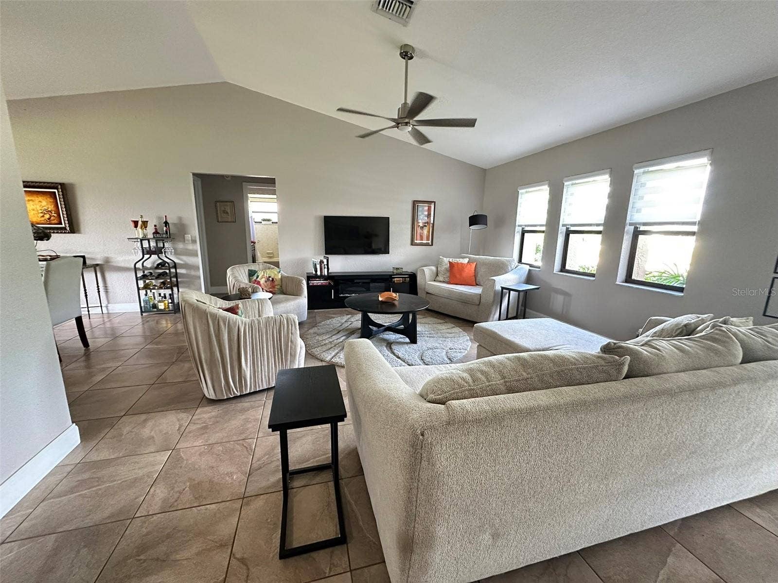 Living room, secondary bedrooms ahead, front door to the right