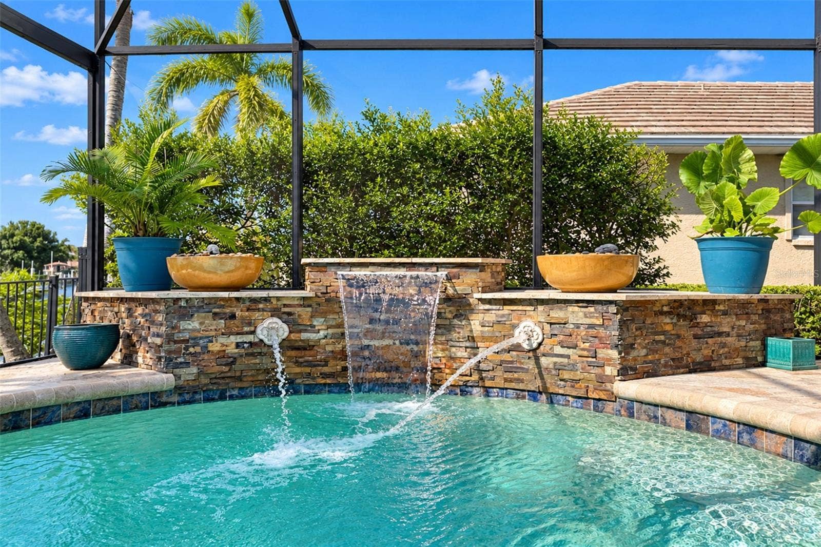 321 PALM ISLES CT, Punta Gorda, FL 33950 Pool with waterfall