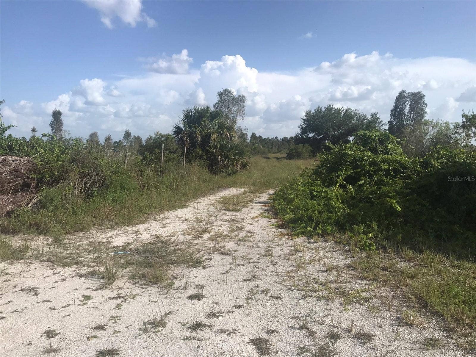 48091 BERMONT ROAD, Punta Gorda, FL 33982 Gate is just about 100 feet ahead. Gate is split in the middle where the lock is and each end swings back to clear entrance.