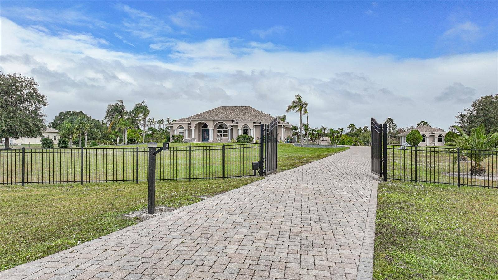 Property is Gorgeous!  Secured, Gated Entry with Long, Paver Drive. 5 Car Garage, Pond, Fenced, 6.39 Acres, Shed with Electric and Patio, Equestrian Trails