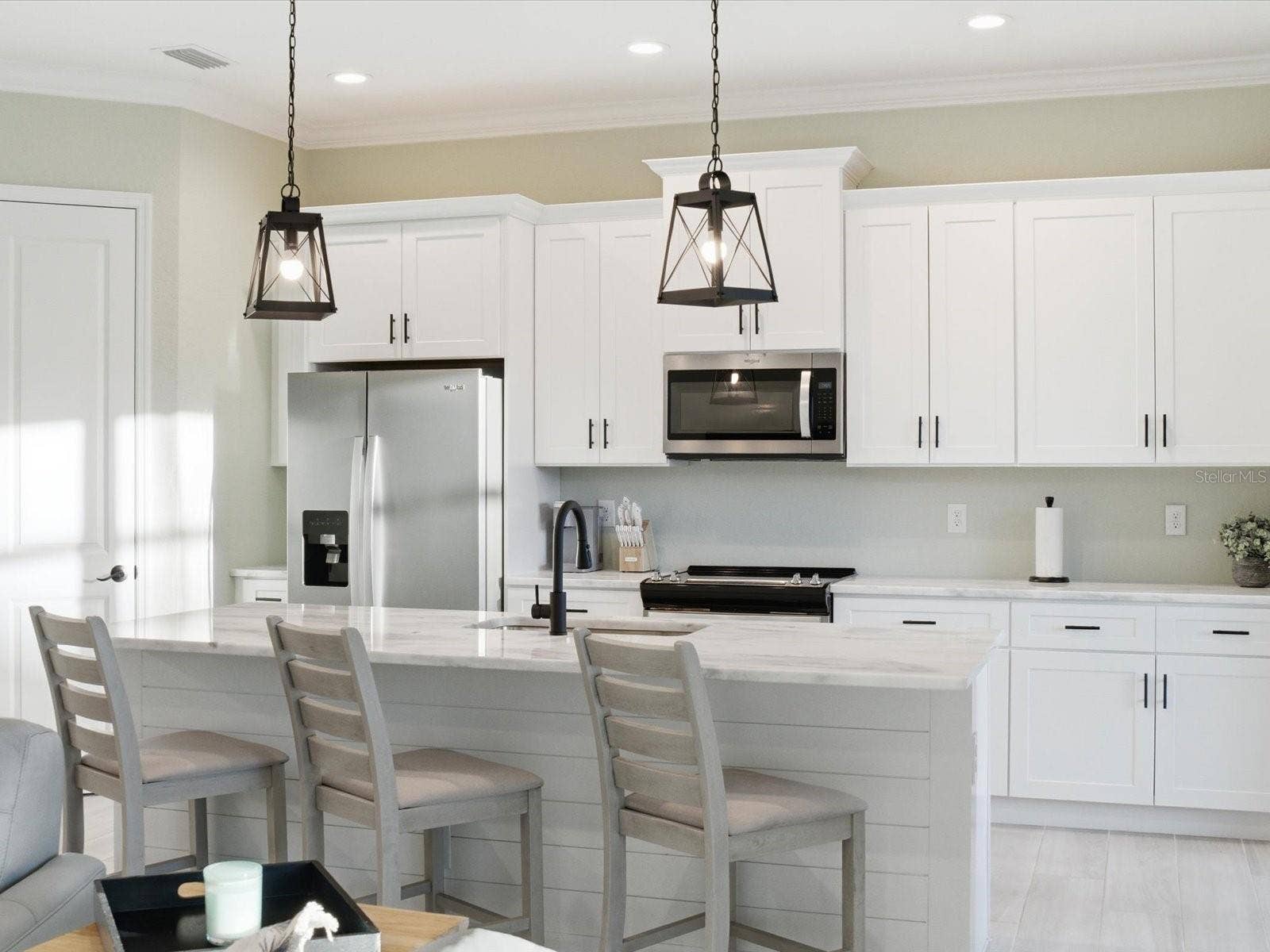 149 LONG MEADOW LANE, Rotonda West, FL 33947 Kitchen island is accented with shiplap