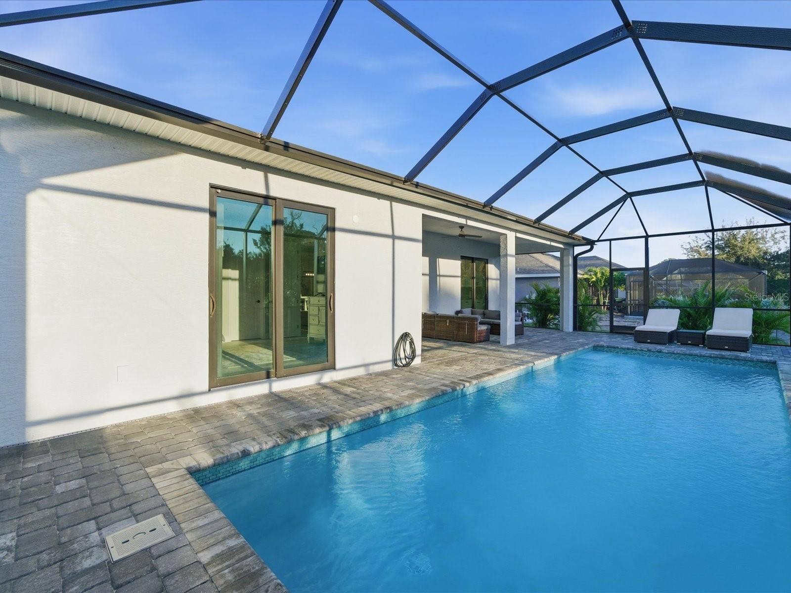149 LONG MEADOW LANE, Rotonda West, FL 33947 Pool area with Primary Suite's private entrance