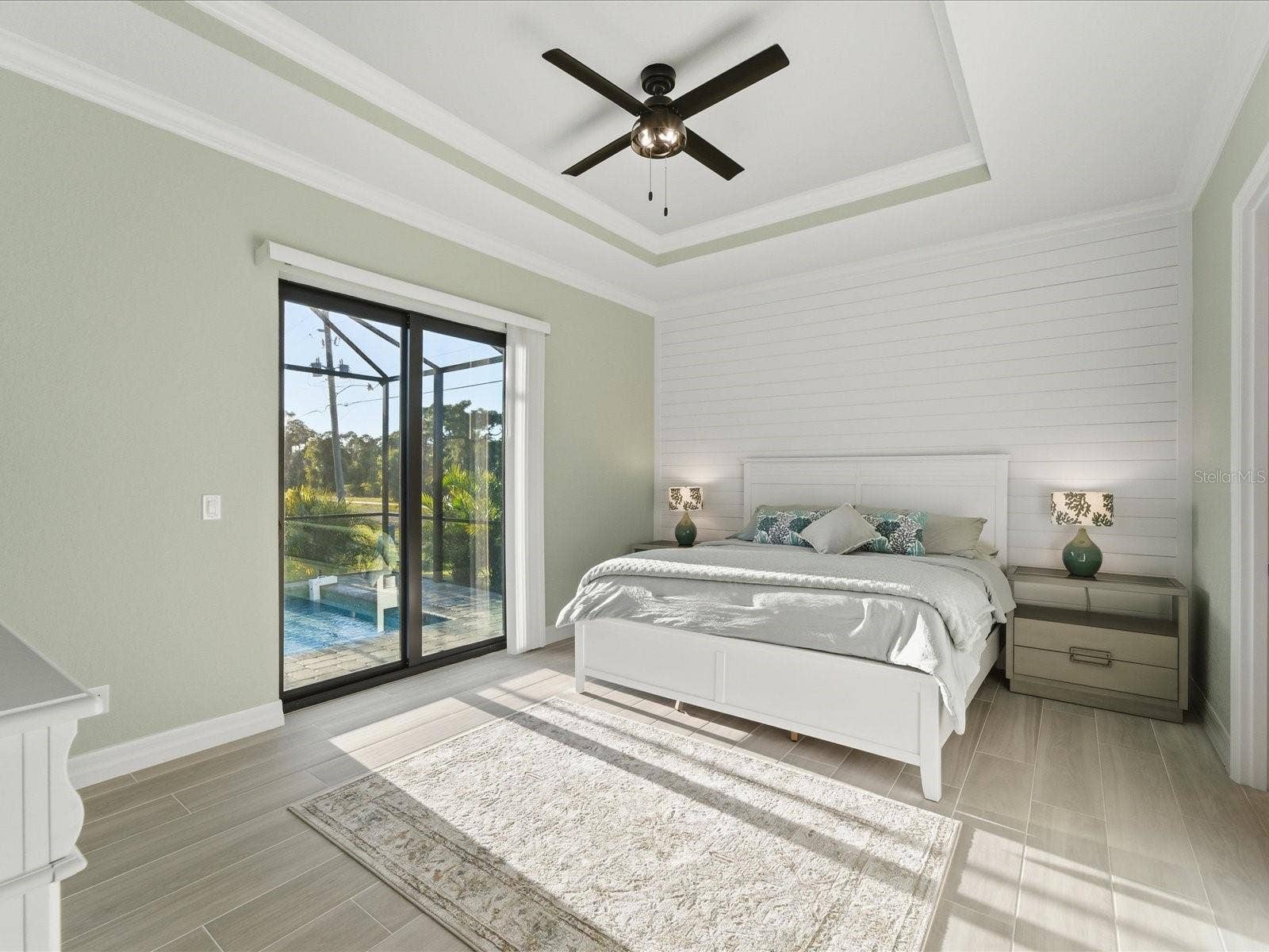 149 LONG MEADOW LANE, Rotonda West, FL 33947 Primary Bedroom with access and view of the pool