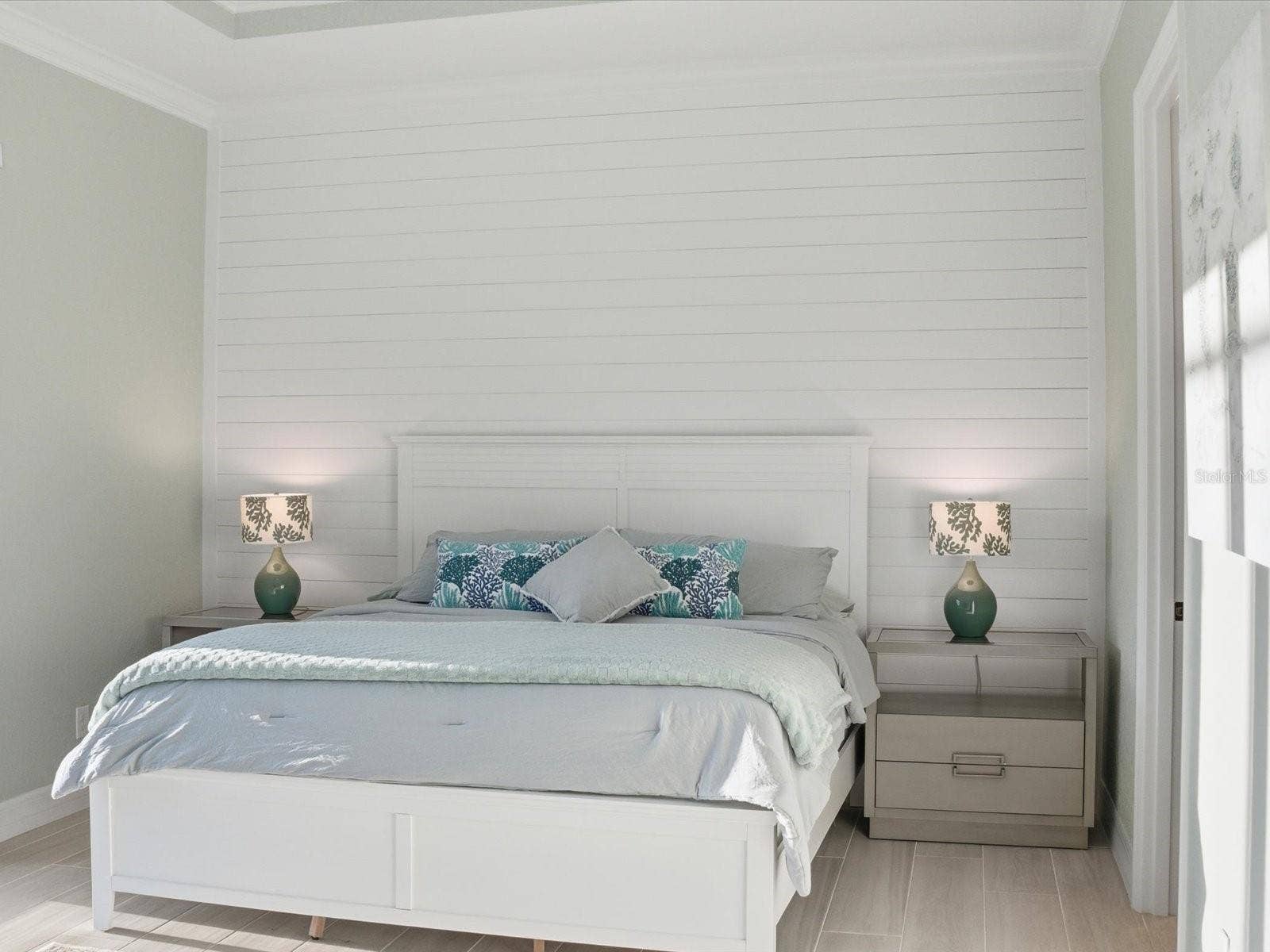 149 LONG MEADOW LANE, Rotonda West, FL 33947 Shiplap accented wall along with crown molding around room and tray ceiling