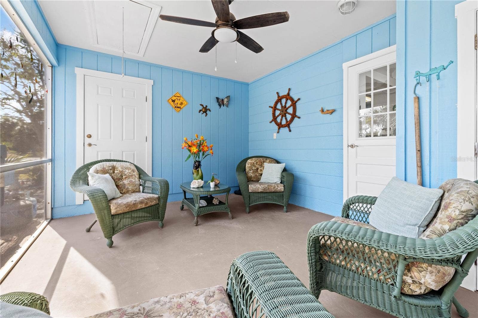 7035 DUKE STREET, Englewood, FL 34224 Another view of the lanai. The door at the rear opens into the third bedroom.