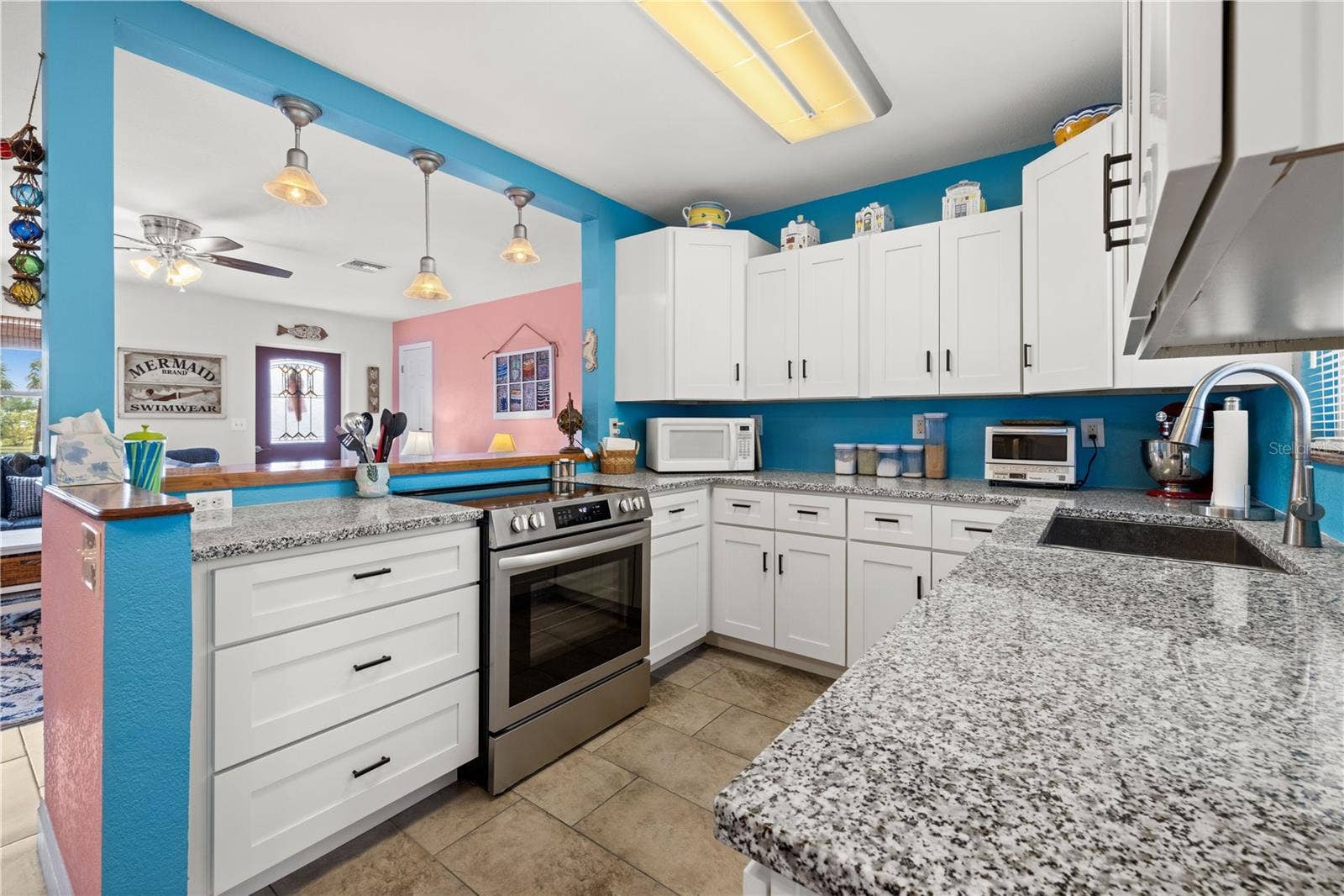 7035 DUKE STREET, Englewood, FL 34224 Here's another view of the kitchen. The kitchen sink is deep and there is an exterior view through the window above it.