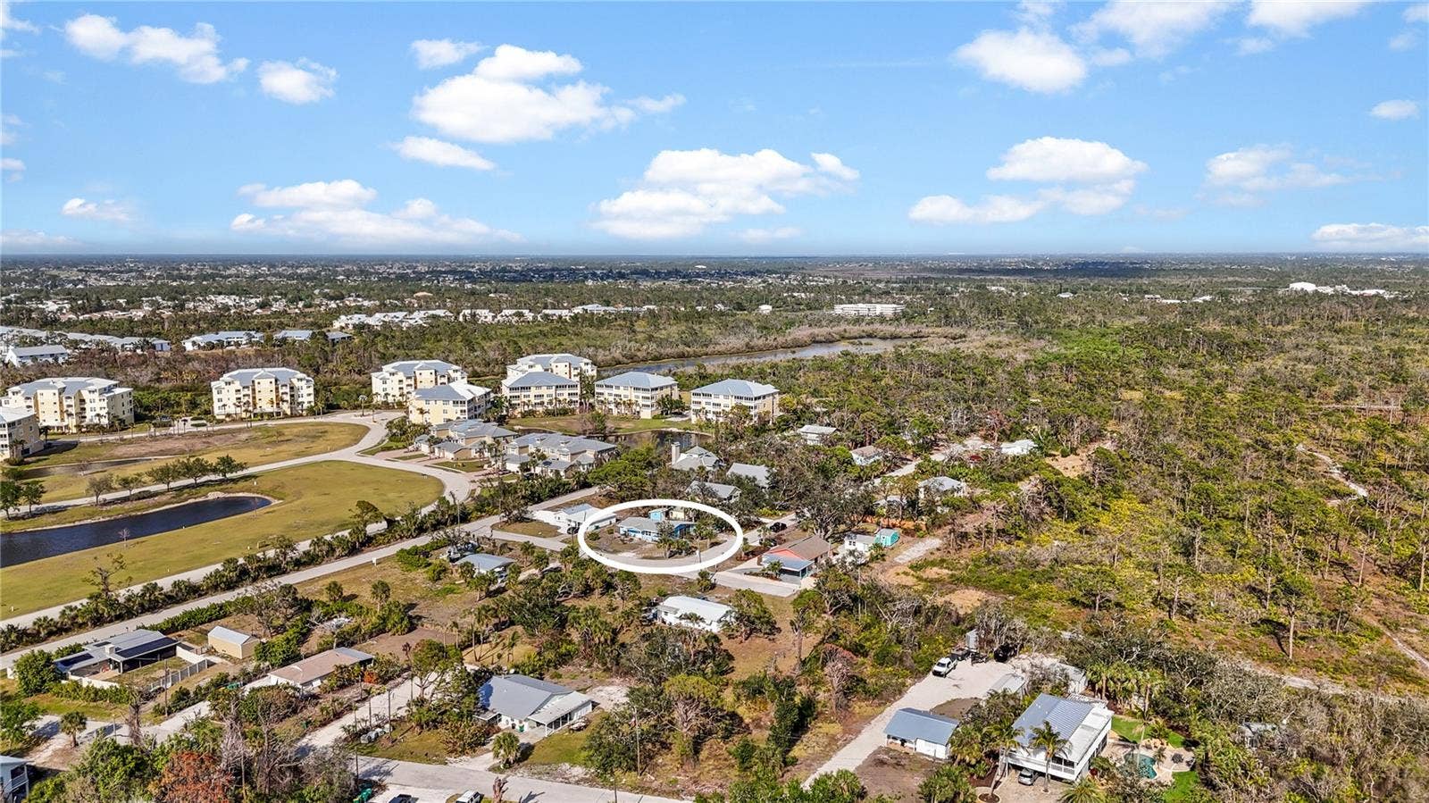 7035 DUKE STREET, Englewood, FL 34224 The large buildings to the north are The Hammocks, and the forested area to the south is portion of the 225 acre Amberjack Environmental Preserve. At the end of the road is a gate where you can enter the Preserve to hike the trails.