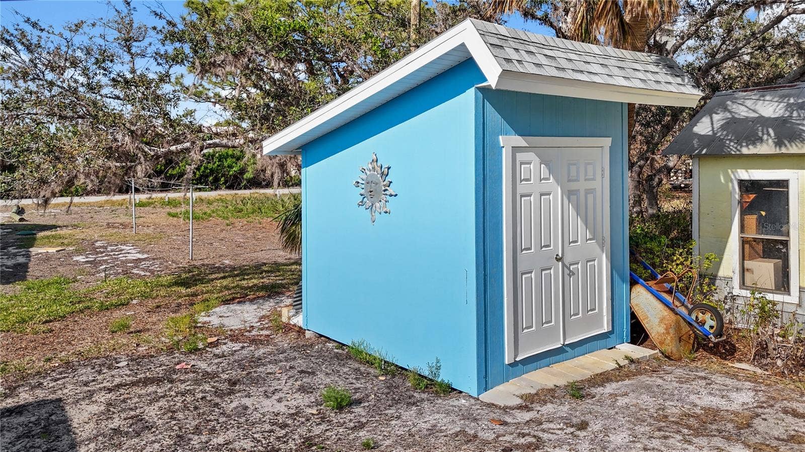 7035 DUKE STREET, Englewood, FL 34224 The backyard hosts it's very own storage shed. Great for tools and garden equipment!