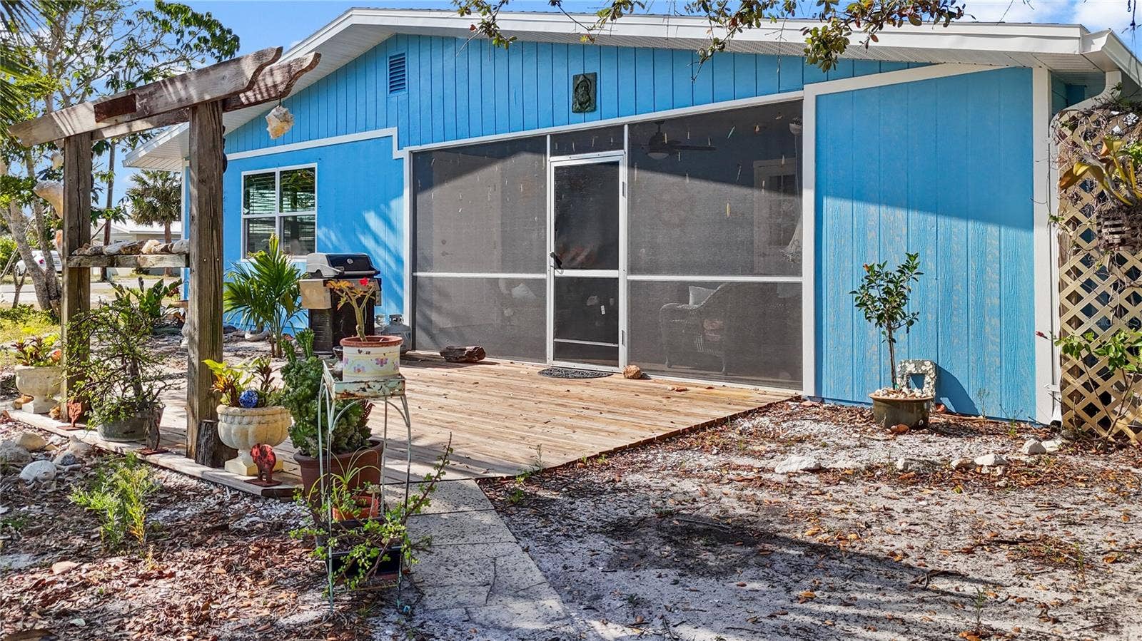 7035 DUKE STREET, Englewood, FL 34224 Outside of the screened lanai is a wooden deck area, which is a great place to sit on spring evenings!