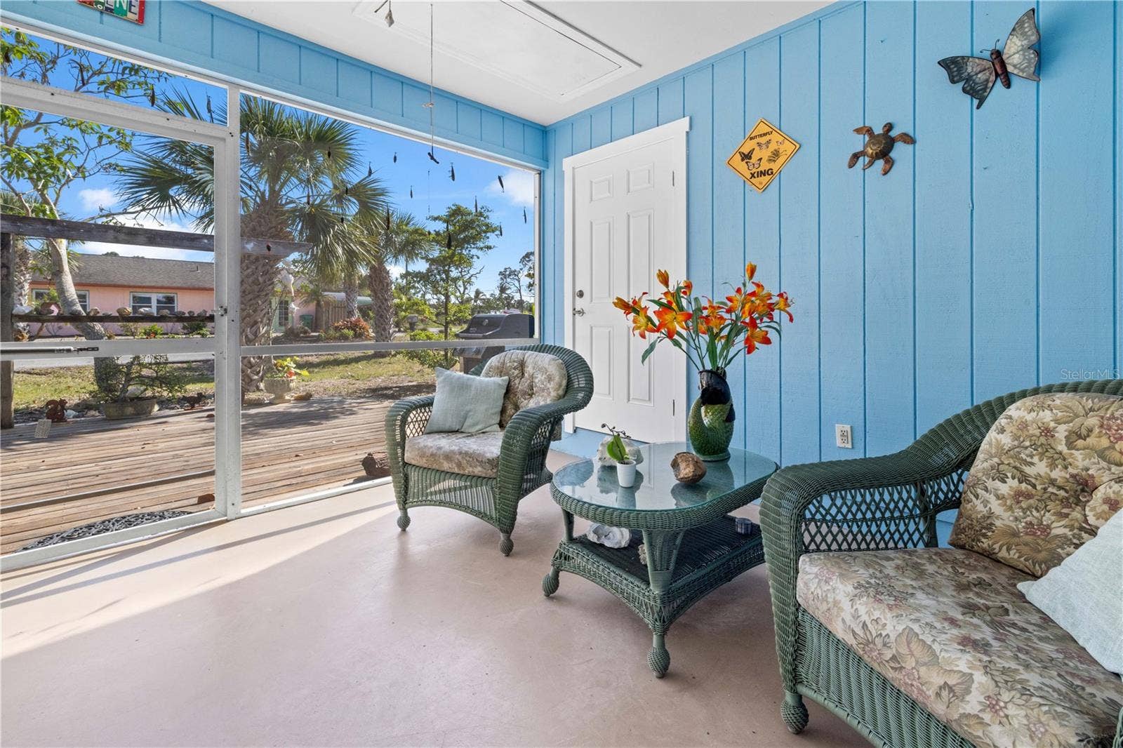 7035 DUKE STREET, Englewood, FL 34224 There are two ways to get to the outside lanai - from the third bedroom/family room or from the kitchen/dining room. It's screened.