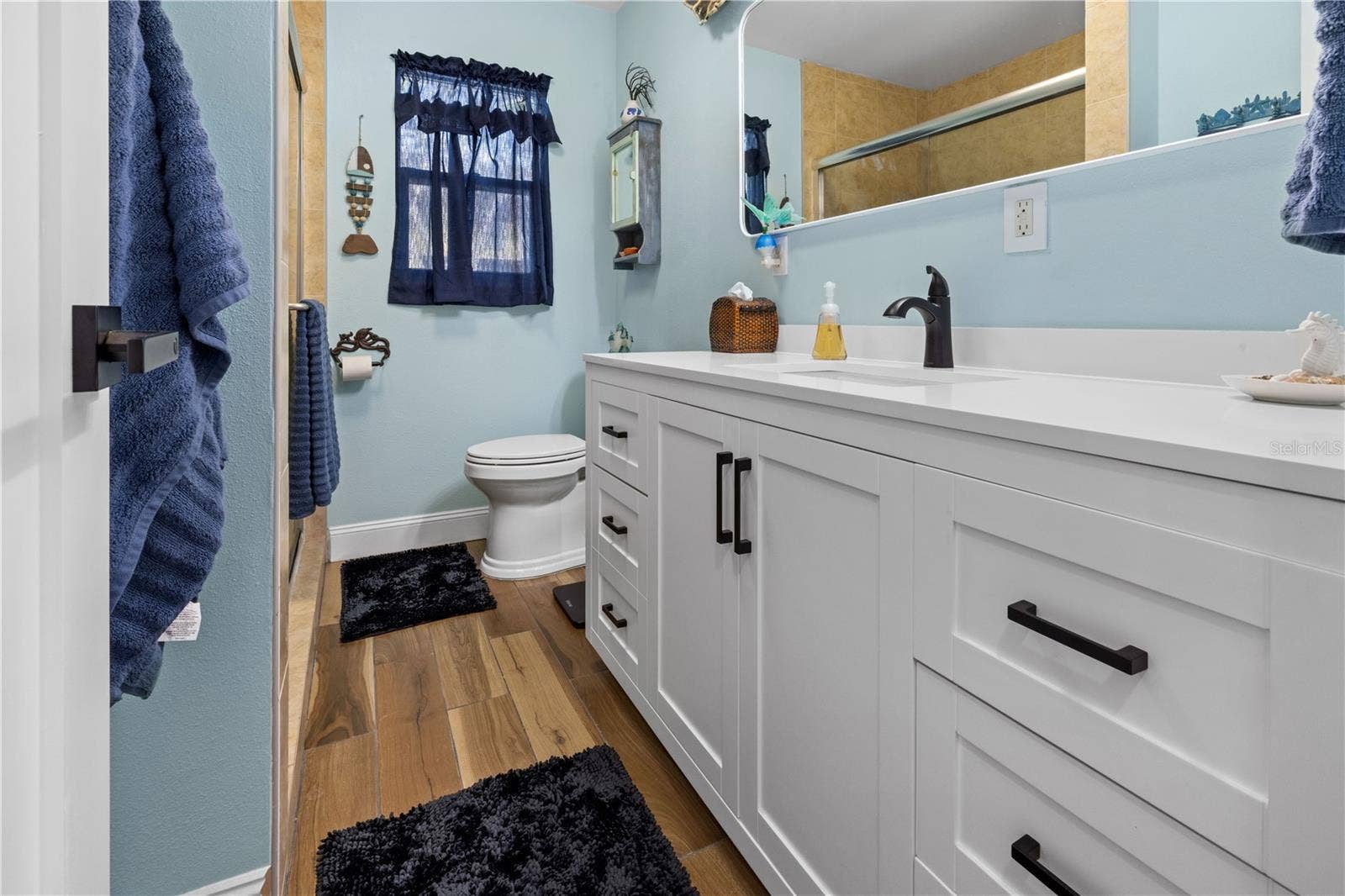 7035 DUKE STREET, Englewood, FL 34224 The bathroom has been updated. It has a shower.