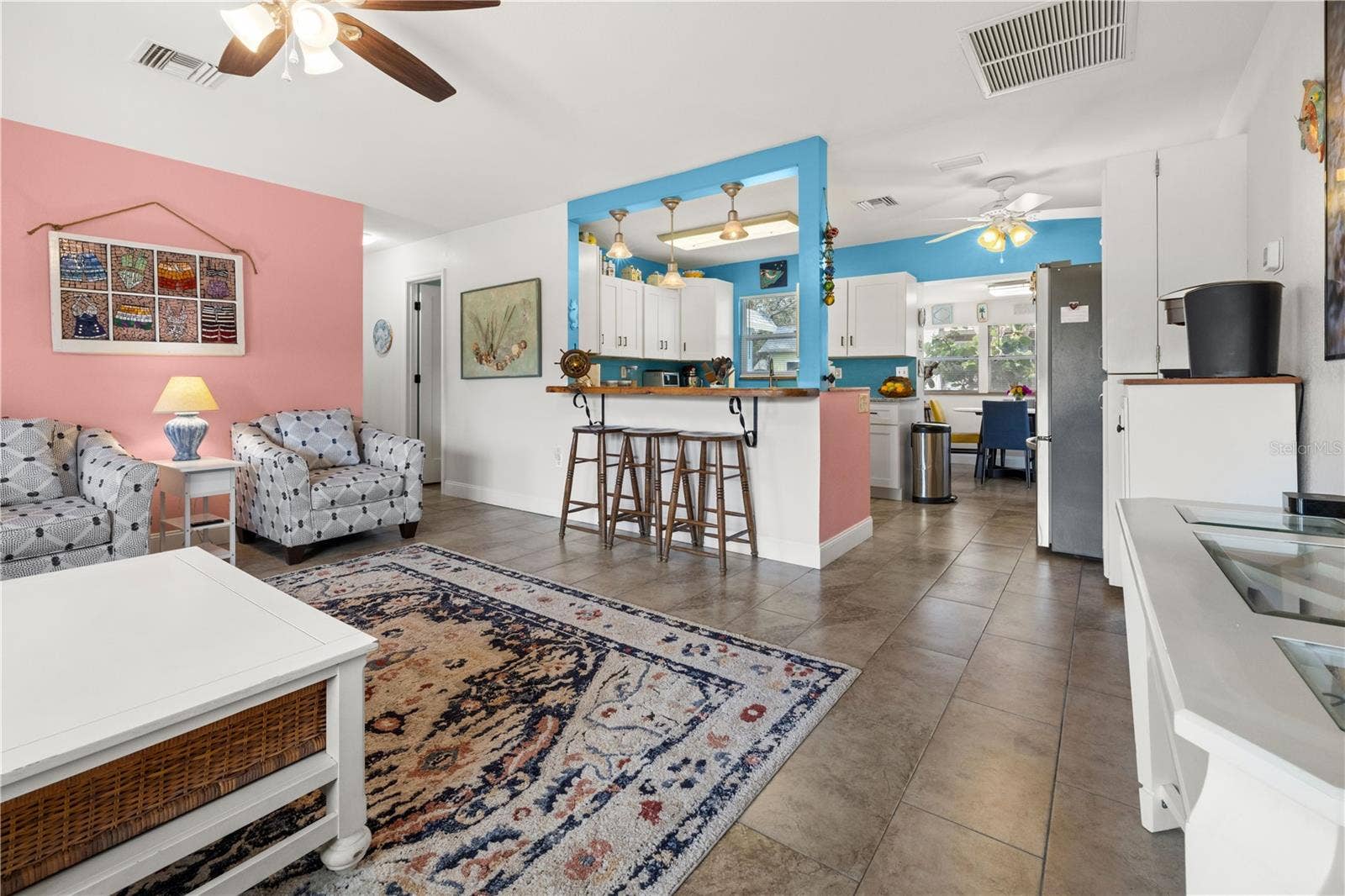 7035 DUKE STREET, Englewood, FL 34224 It has an open floor plan in the living area with a counter that peeks into the kitchen. The dining area in the rear has views of the yard.