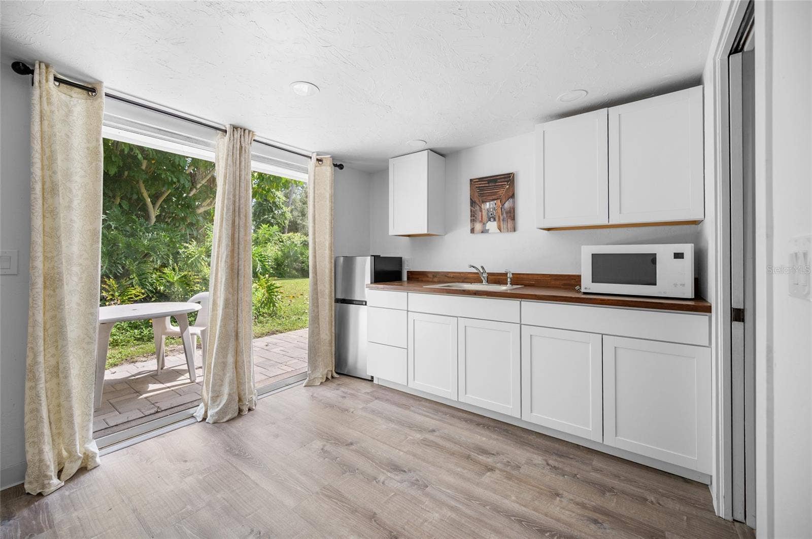 2111 HEASLEY ROAD, Englewood, FL 34223 kitchenette with a private porch space
