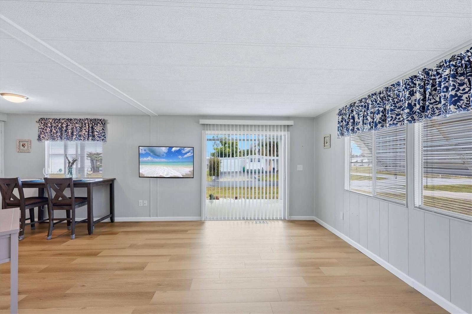240 VIA DE LUNA, Englewood, FL 34224 Living room with sliders leading to front porch