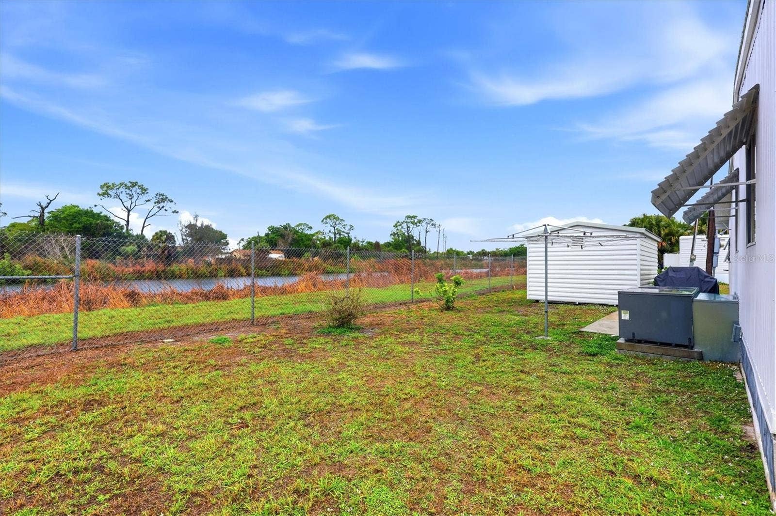 240 VIA DE LUNA, Englewood, FL 34224 Backyard with second shed
