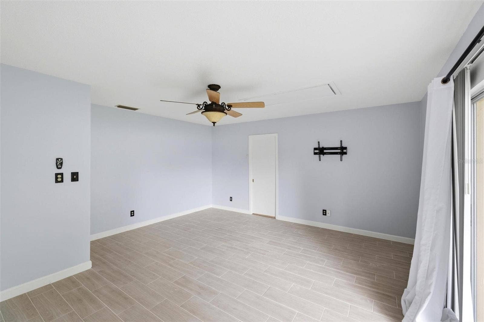 Lots of floorspace in this primary bedroom with ensuite bathroom and closet