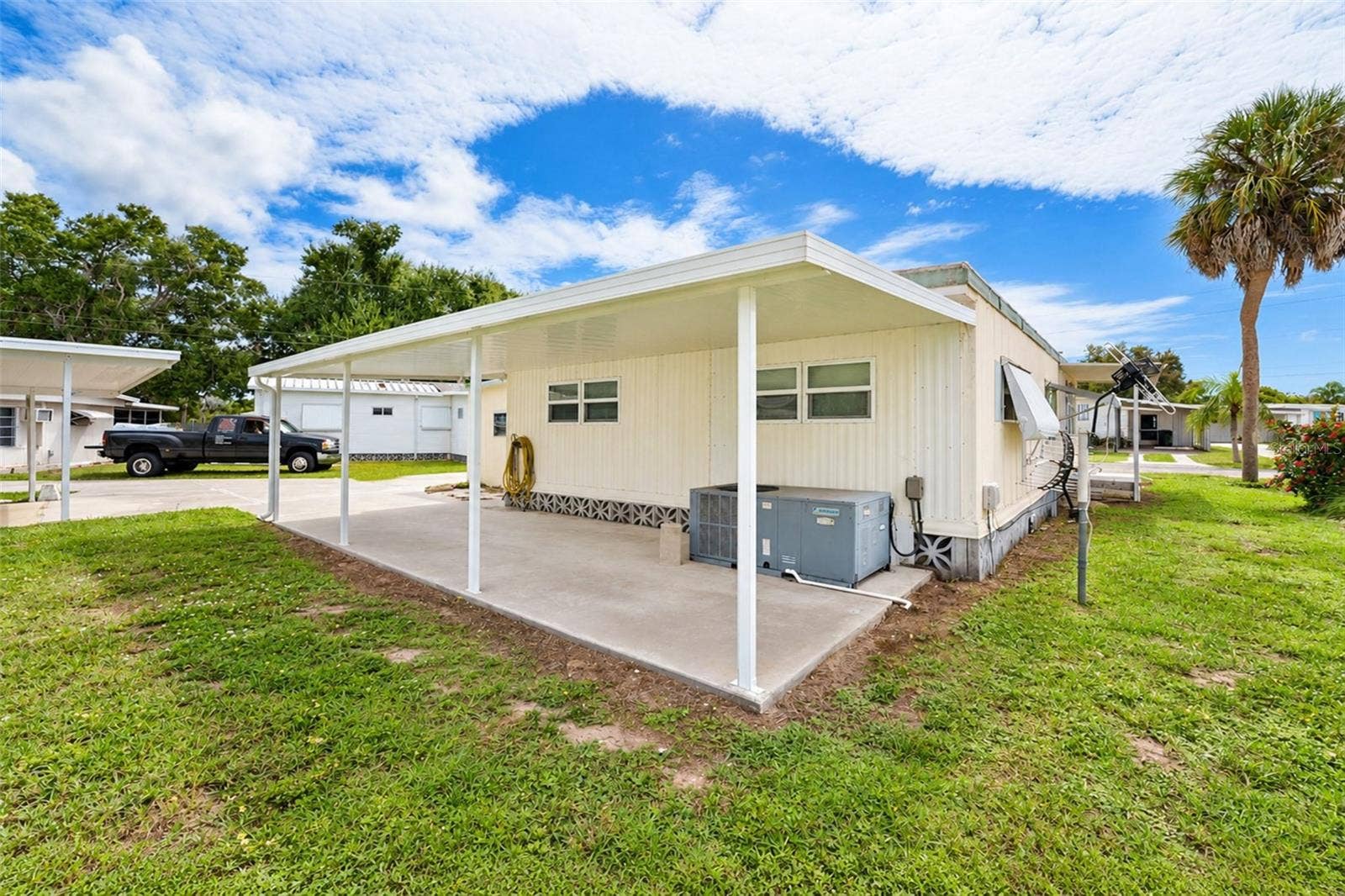 1891 ENGLEWOOD ROAD, #165, Englewood, FL 34223 Carport in rear