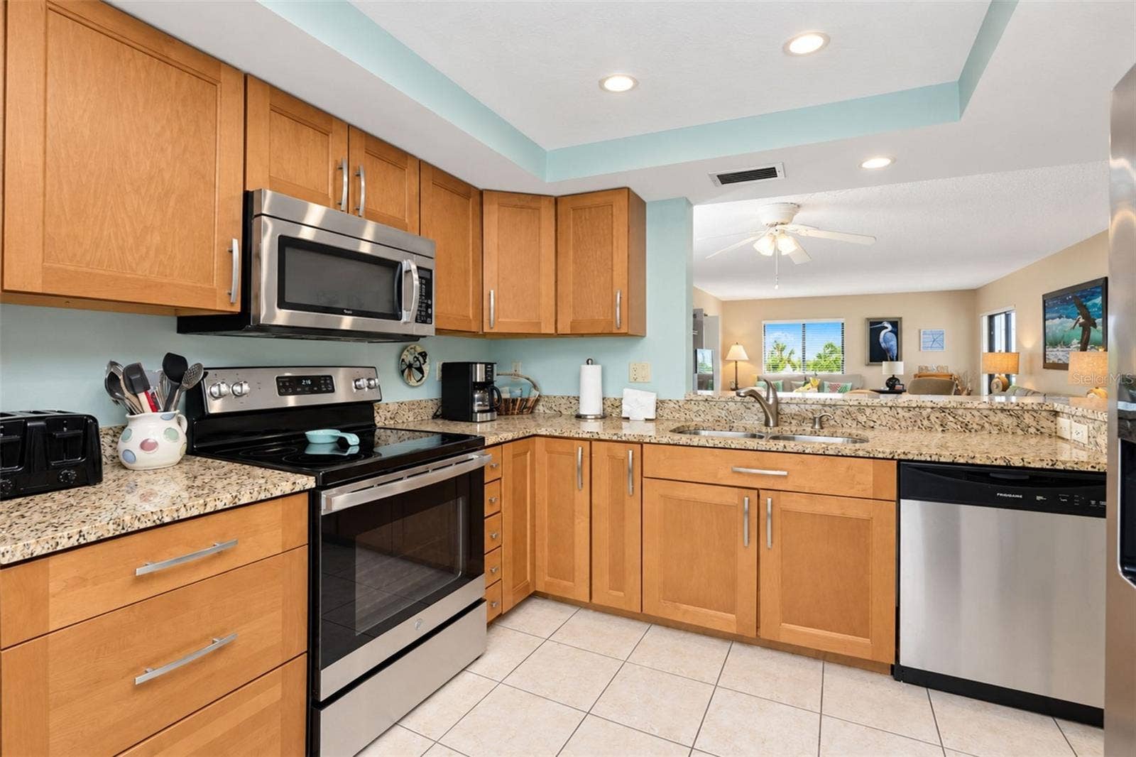 2950 N BEACH ROAD, #A321, Englewood, FL 34223 The maple cabinetry and granite countertop is very pretty!