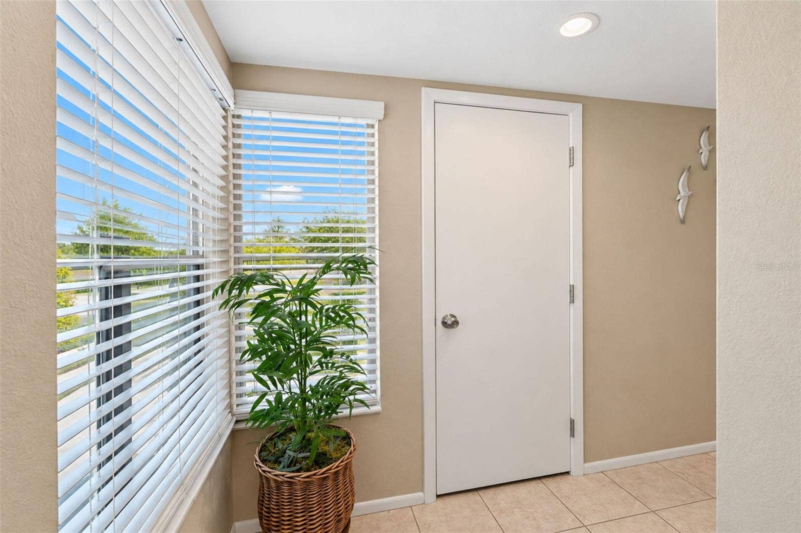 2950 N BEACH ROAD, #A321, Englewood, FL 34223 The front entry has tiled flooring and natural light.