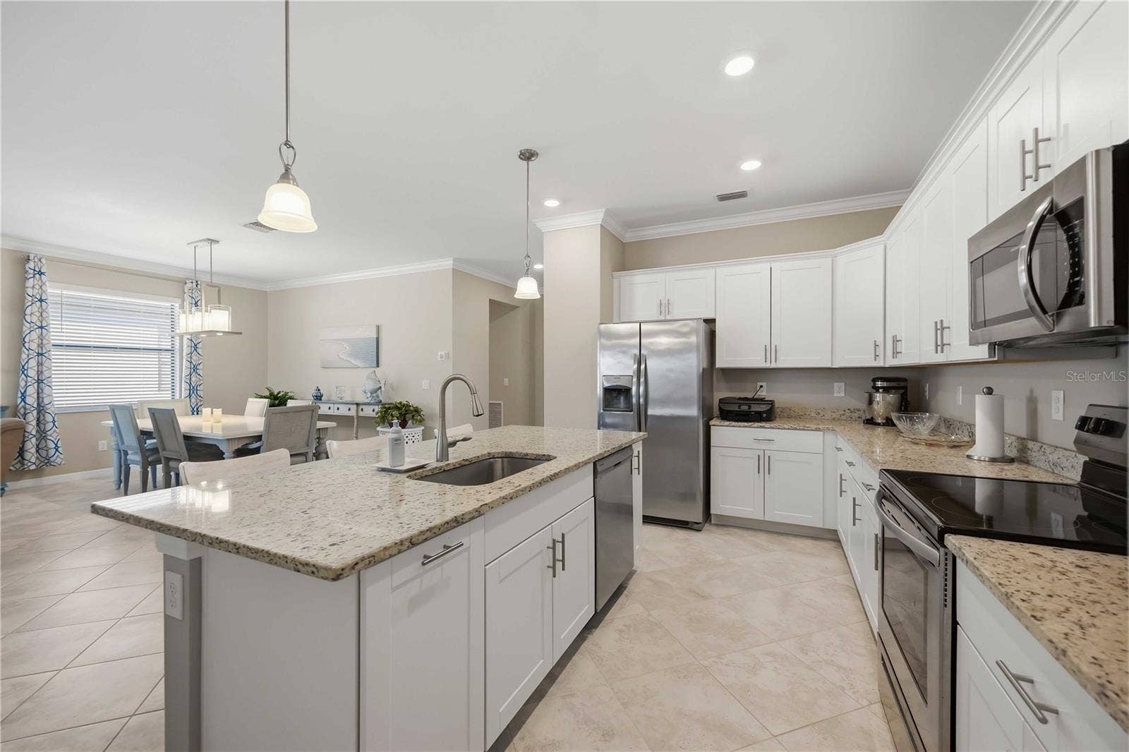 15945 HONEY SUCKLE STREET, Port Charlotte, FL 33953 Granite counters, stainless steel appliances and white shaker cabinetry