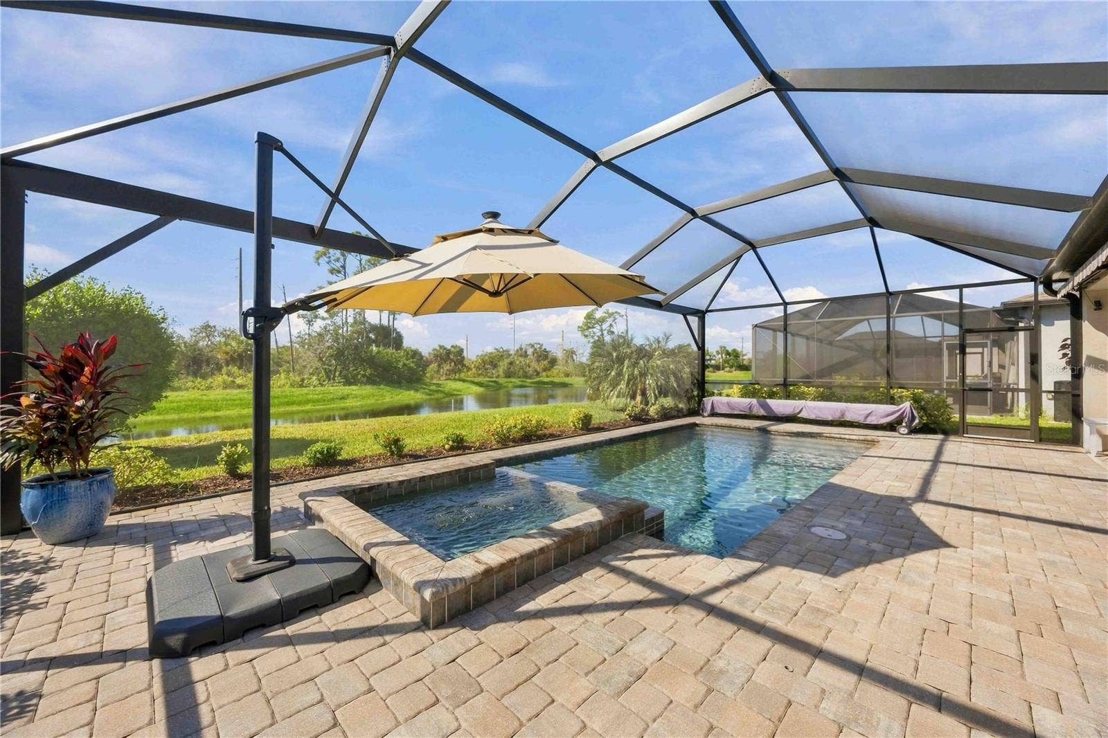 15945 HONEY SUCKLE STREET, Port Charlotte, FL 33953 Imagine spending your days enjoying this pool and view!