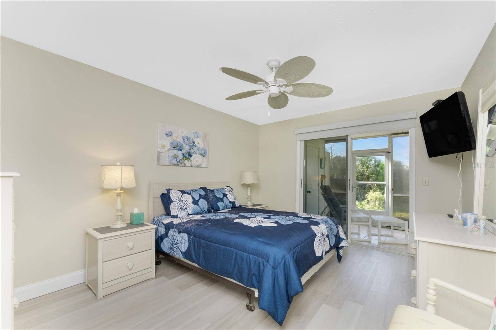 6600 GASPARILLA PINES BOULEVARD, #14-103, Englewood, FL 34224 Primary Bedroom has sliding glass doors opening onto the lanai