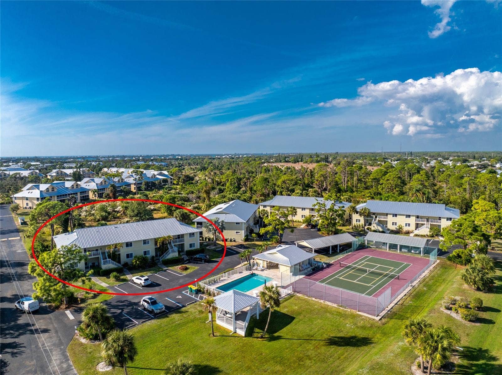 6600 GASPARILLA PINES BOULEVARD, #14-103, Englewood, FL 34224 Aerial #2 - notice that you are across the parking area from the clubhouse & pool and tennis/pickleball courts!