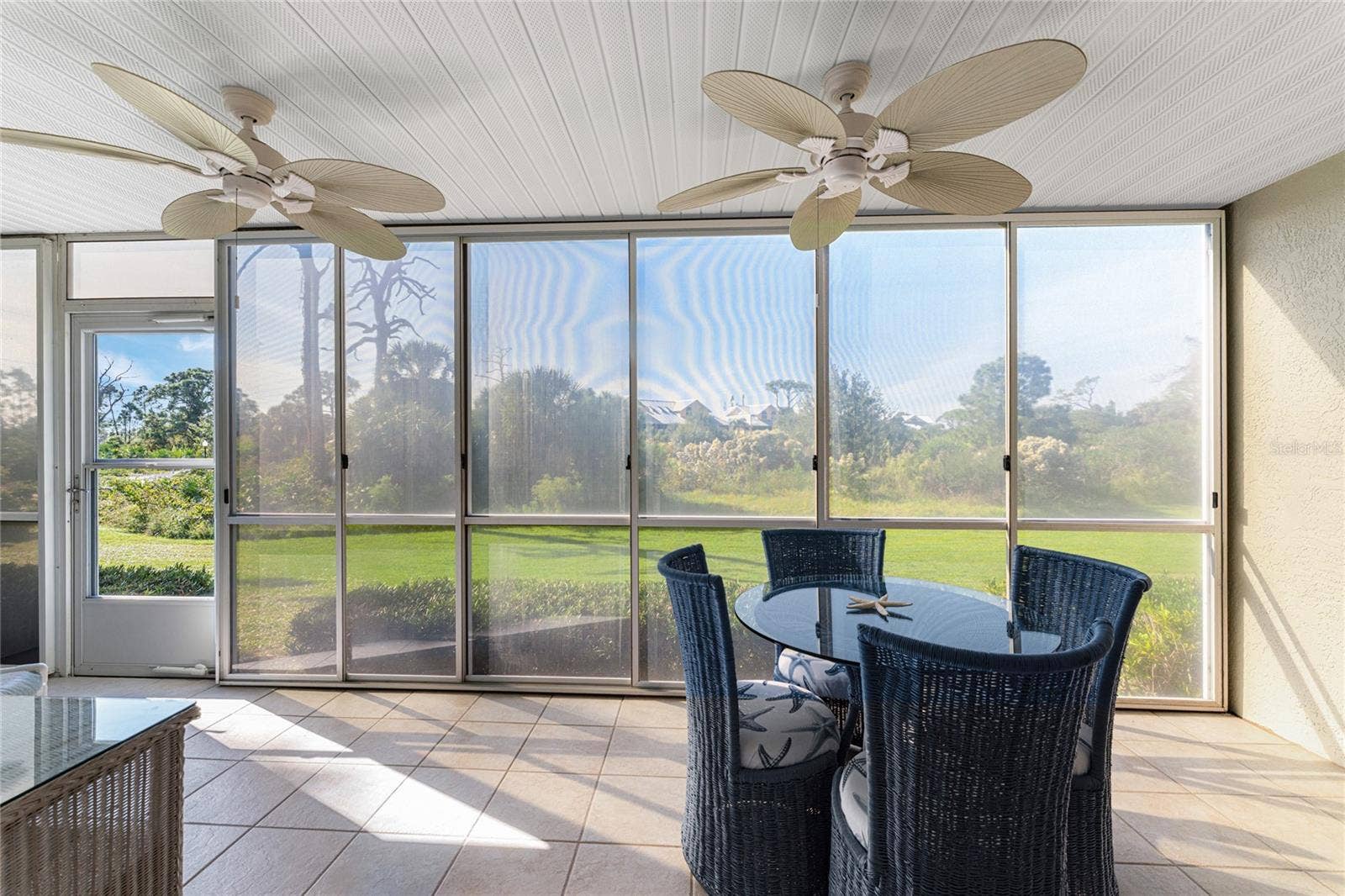 6600 GASPARILLA PINES BOULEVARD, #14-103, Englewood, FL 34224 Vinyl enclosed lanai overlooks Wildflower Preserve.