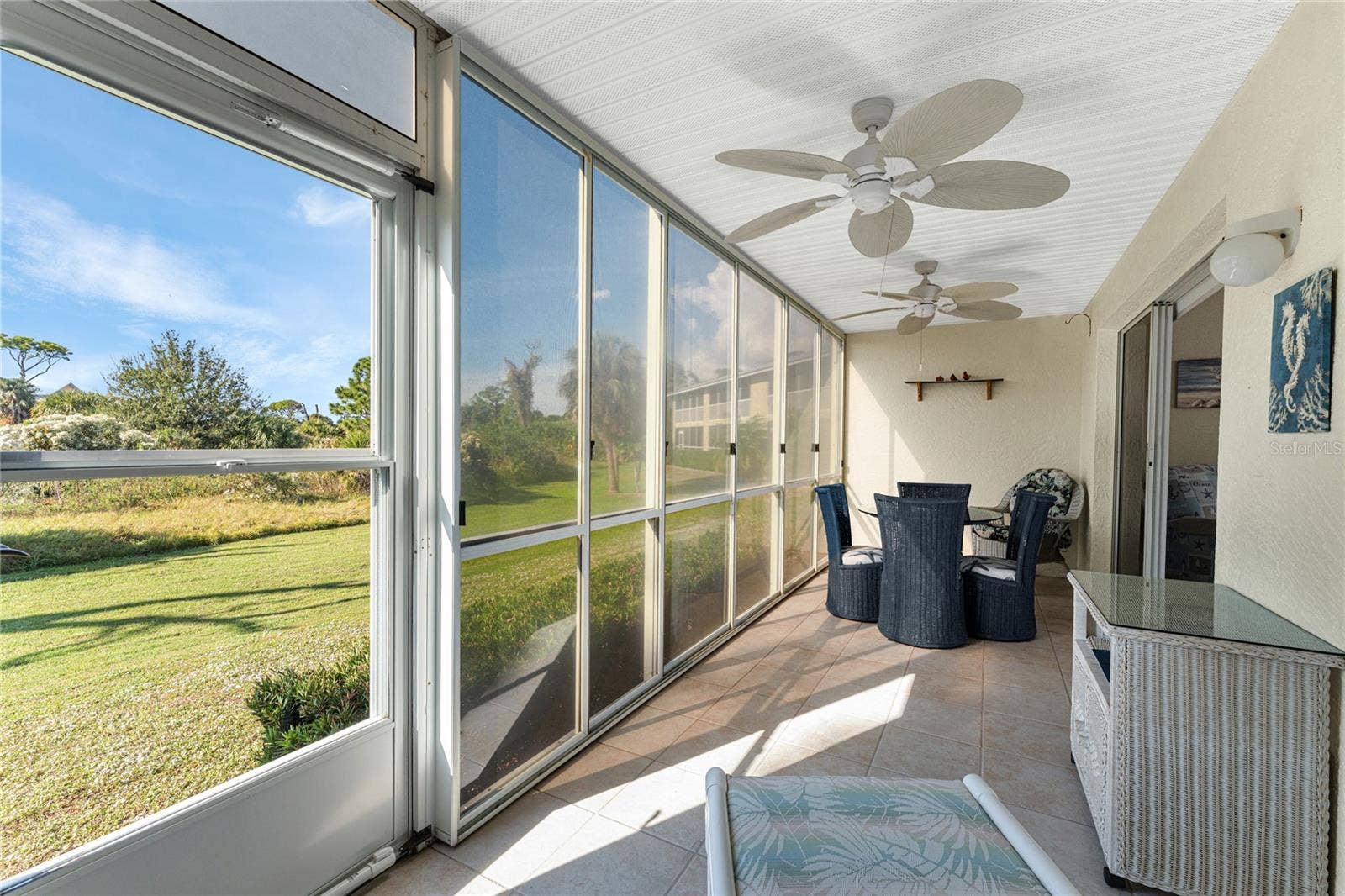6600 GASPARILLA PINES BOULEVARD, #14-103, Englewood, FL 34224 Vinyl enclosed lanai overlooks Wildflower Preserve.