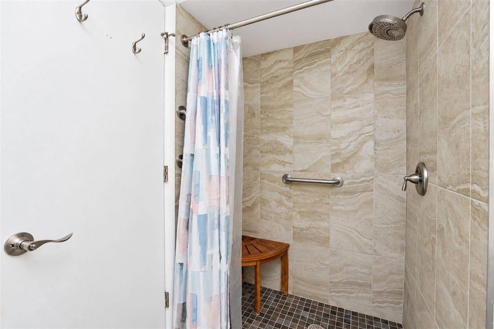 6468 HAMLET DRIVE, #B, Englewood, FL 34224 The ensuite bathroom has a step-in shower with new tile.