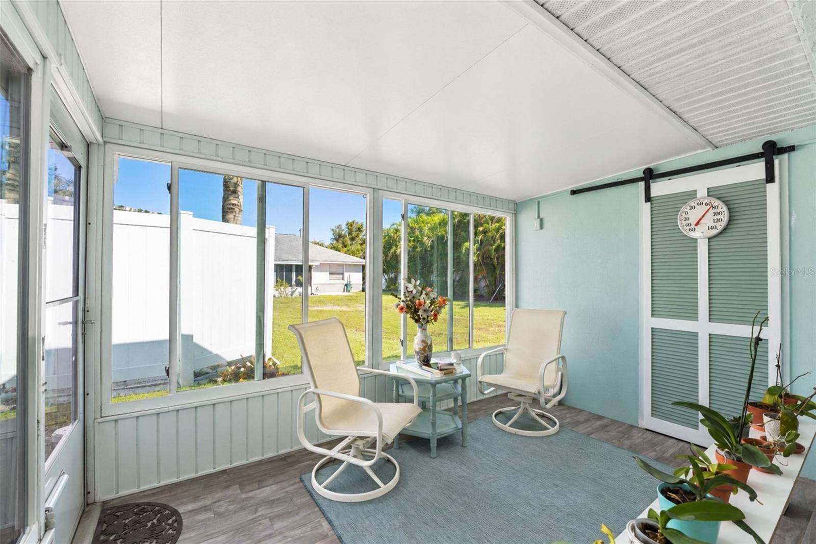 6468 HAMLET DRIVE, #B, Englewood, FL 34224 There is a door from the Florida room to rear patio.