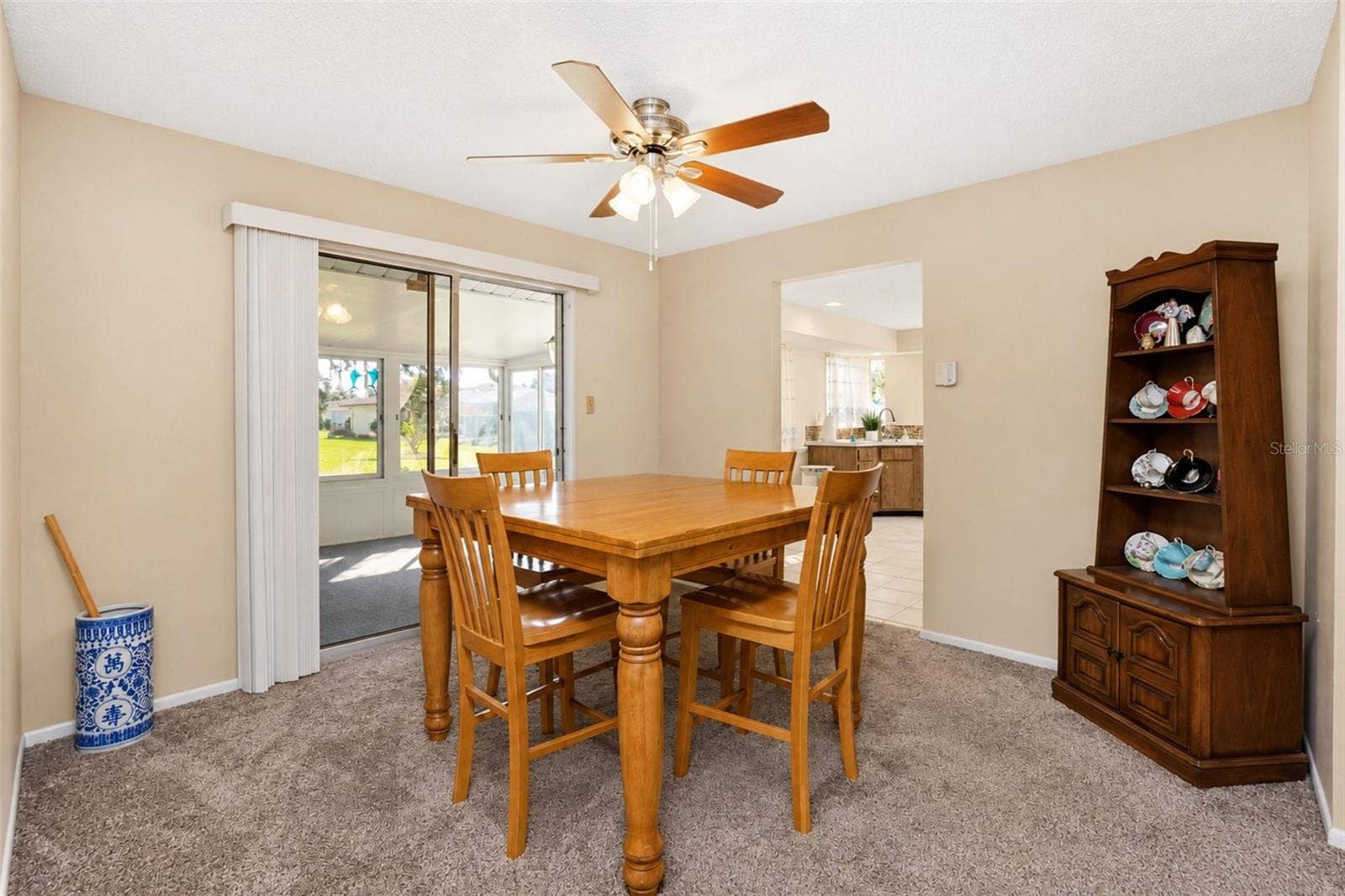 Dining room leads to enclosed lanai/florida room