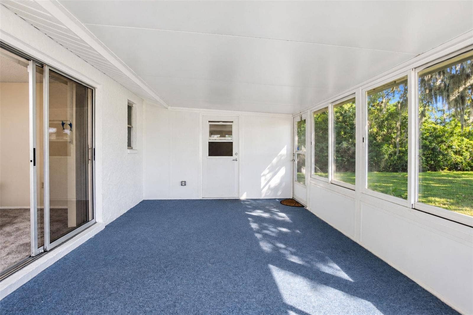 Enclosed lanai/Florida room leads to separate storage room