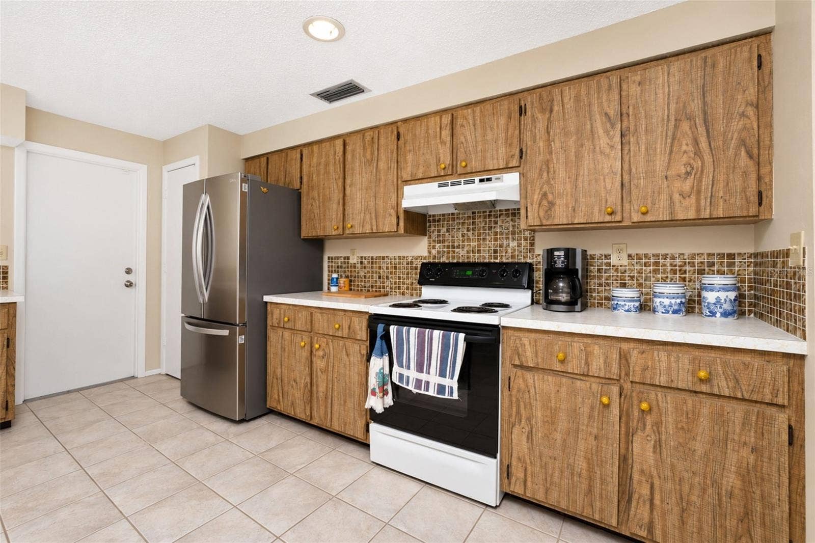 Kitchen leads to garage