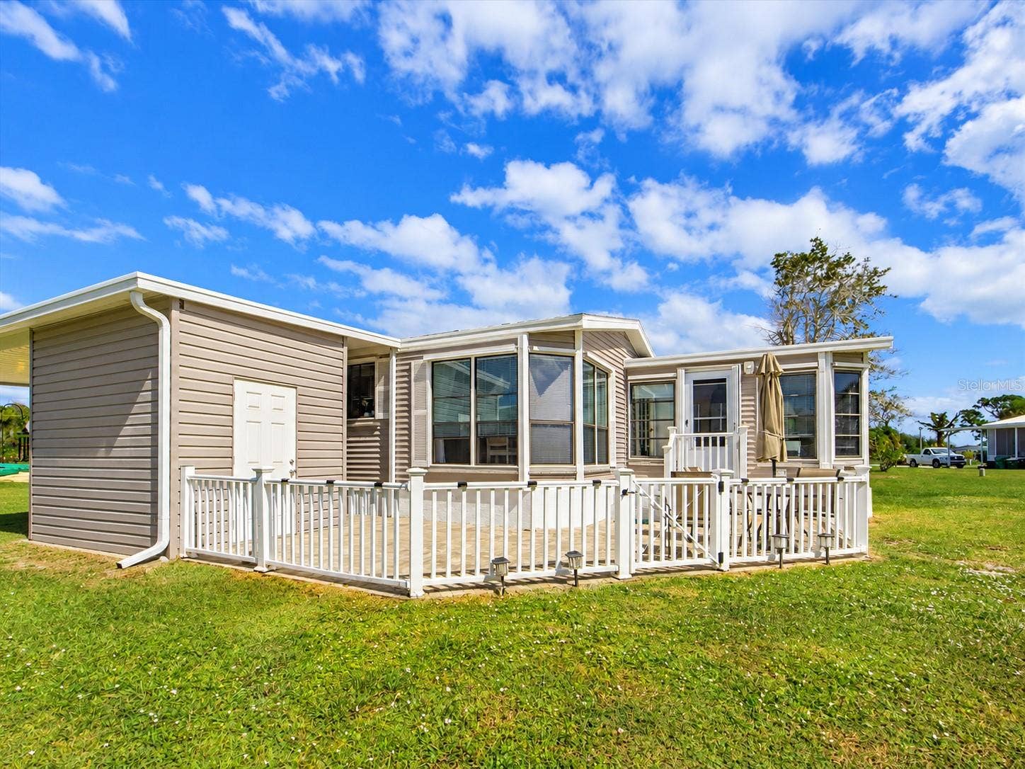 THE PATIO IS FULLY FENCED. THE STORAGE SHED HAS FRONT AND BACK DOOR FOR EASY ACCESS. STEPS ON THE BACK  RIGHT LEAD TO THE FLORDIA ROOM.