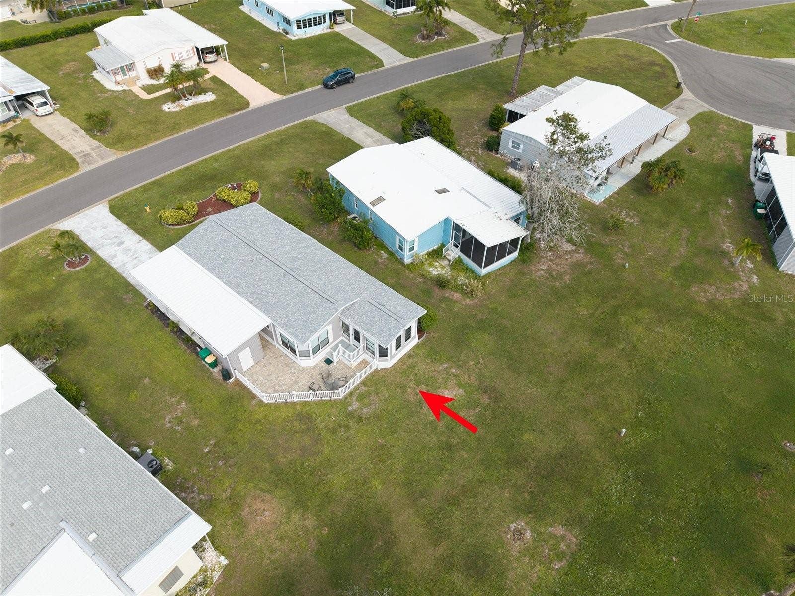 OVERAL AERIAL VIEW OF THE PROPERTY AND POND. ROOF REPLACED 2024.