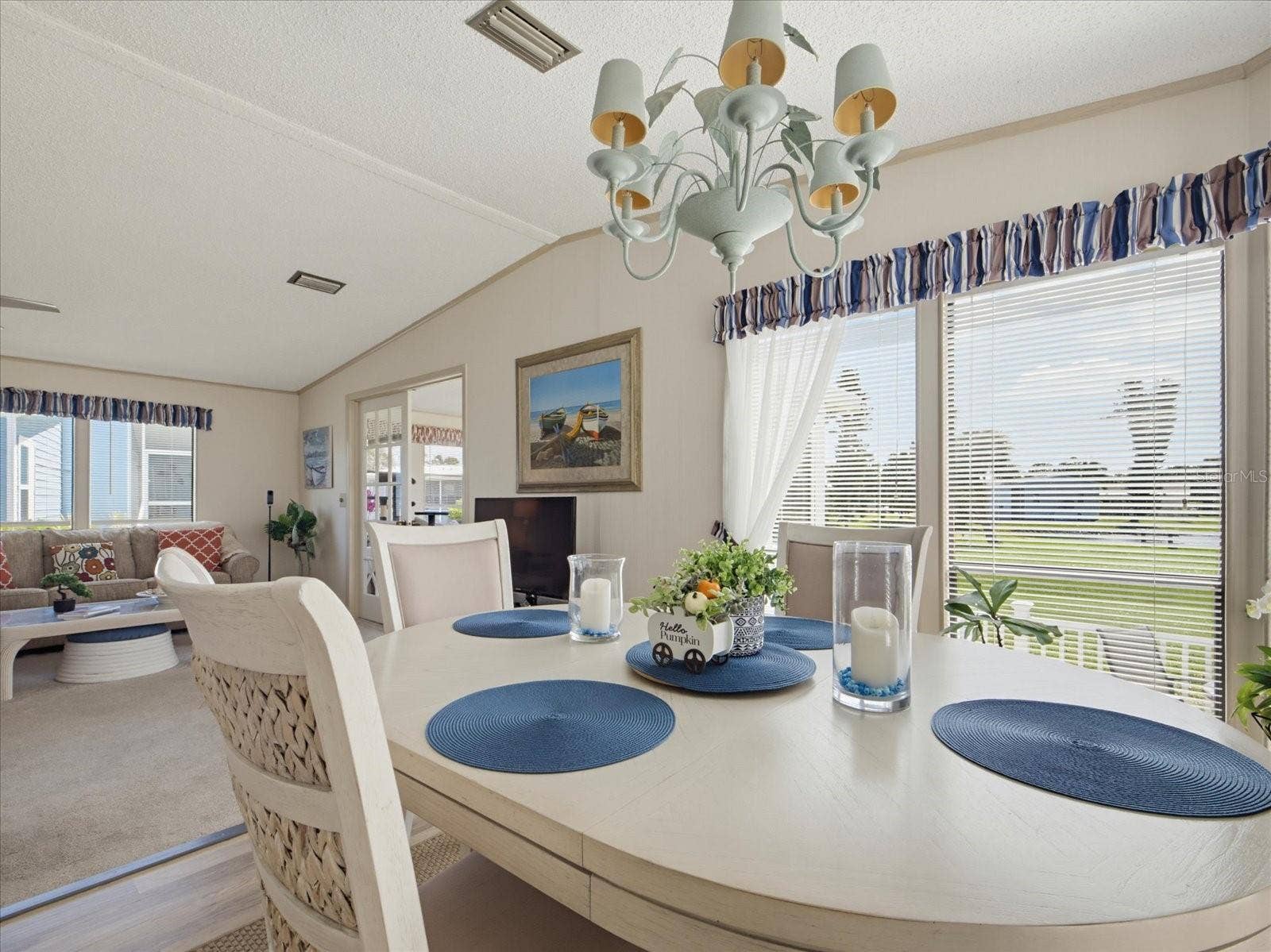 THE DINING ROOM FEATURES A RELAXING WATER VIEW.