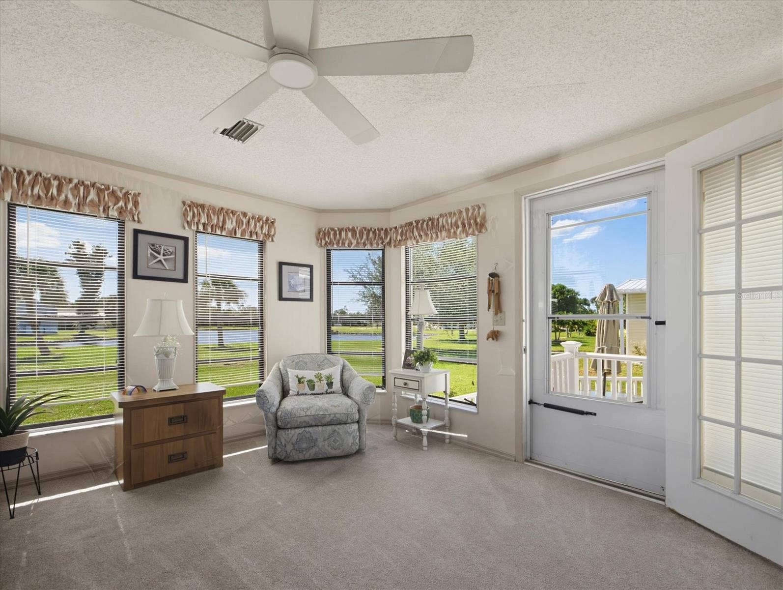 THE FLORIDA ROOM HAS AWESOME VEIW OF THE POND WITH EASY ACCESS TO THE PATIO.